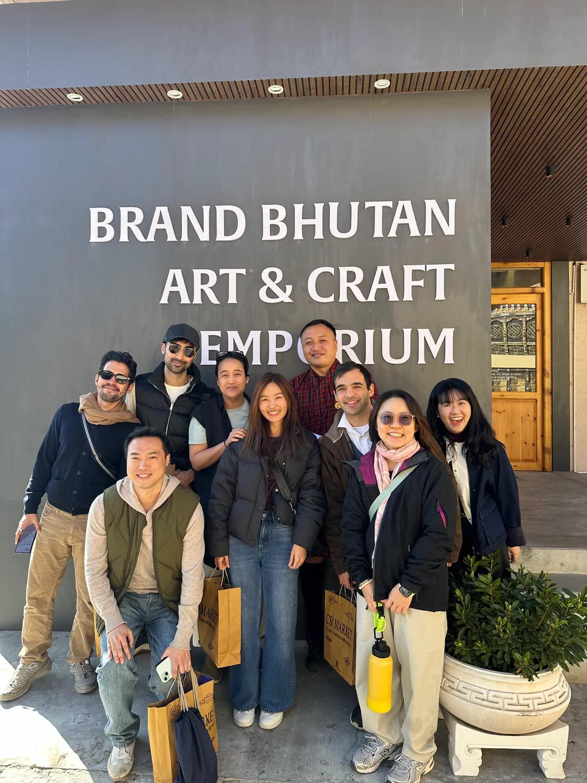 Travelers with their shopping outside the Brand Bhutan Art and Craft Emporium